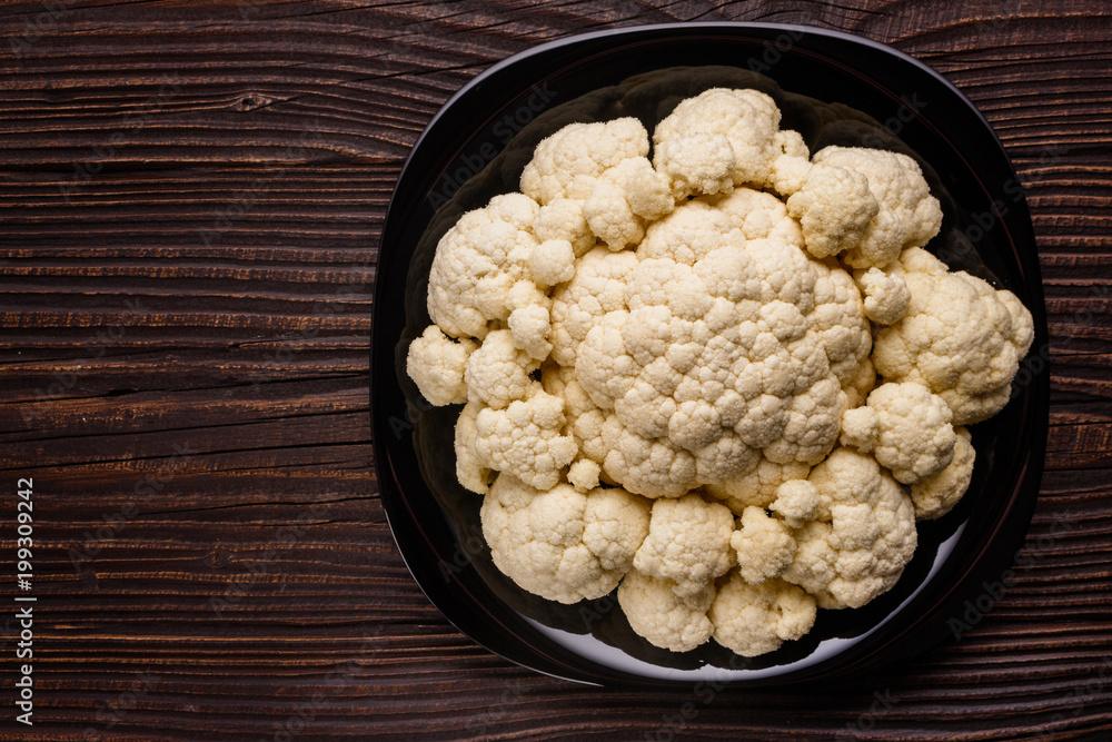 fresh cauliflower on a rustic wooden background fresh cauliflower on a rustic wooden background