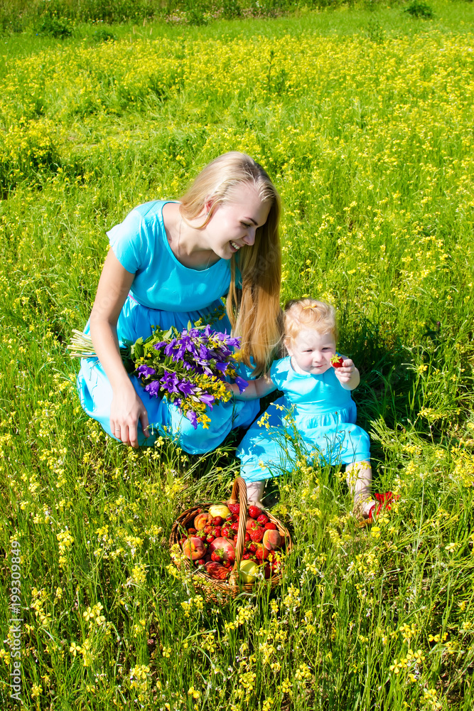 caucasian mother paying with daughter park