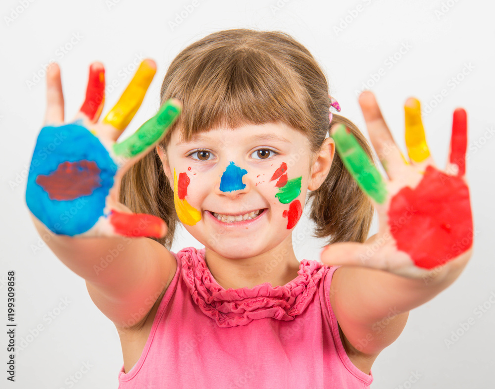 smiling little girl with hands painted in colorful paints smiling little girl with hands painted in colorful paints