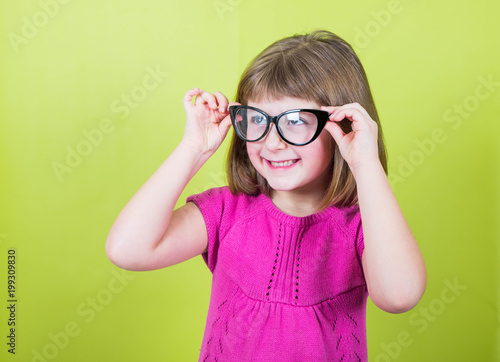 smiling little girl with glasses 