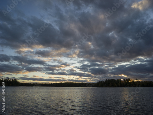 Clouds over lake at dusk, Kenora, Lake of the Woods, Ontario, Canada