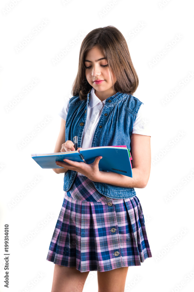 beautiful girl in school uniform with a notebook in her hand on a white background beautiful girl in school uniform with a notebook in her hand on a white background