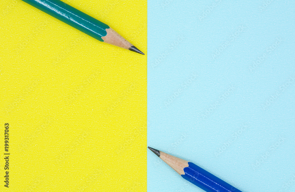 blue and green pencil on blue and yellow paper - background blue and green pencil on blue and yellow paper - background