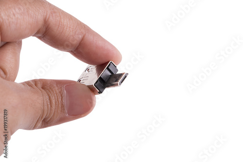 Hand holding USB drive adapter isolated over the white background.