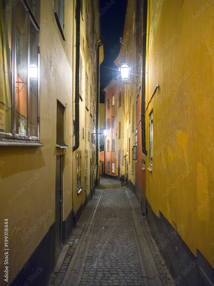 View of narrow street at night, Stockholm, Sweden