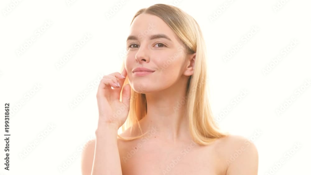 The beauty woman flirting on the white background. slow motion The beauty woman flirting on the white background. slow motion