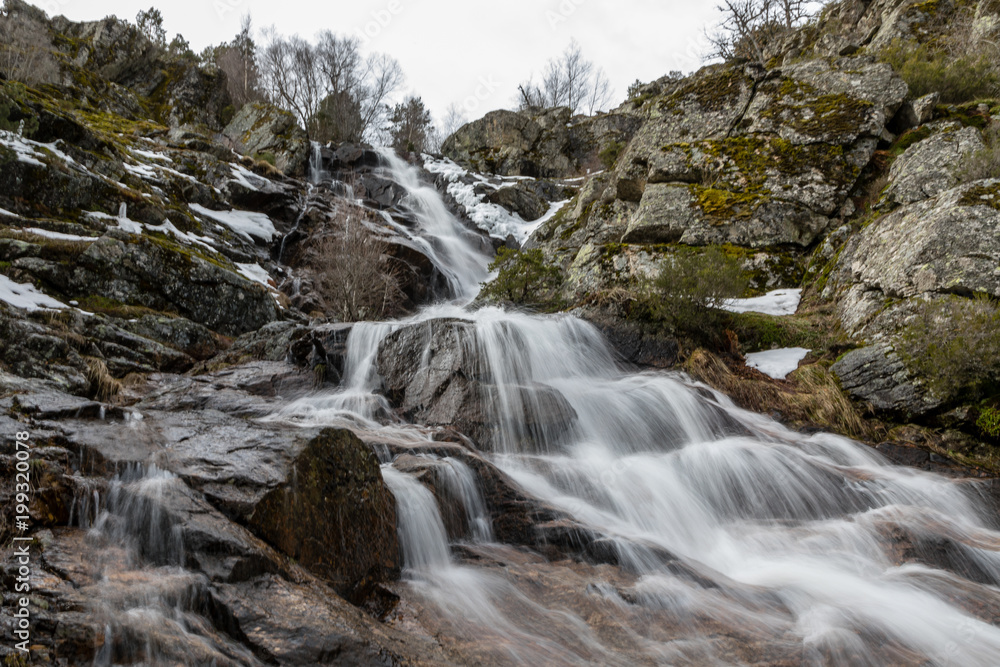Waterfall from snow melt in the mountains of Madrid, Spain Waterfall from snow melt in the mountains of Madrid, Spain