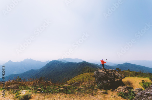 people selfie on the rock on mountain nature landscape with blue sky. © thithawat
