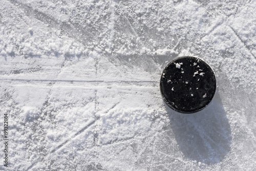 hockey puck lies on the ice in the stadium