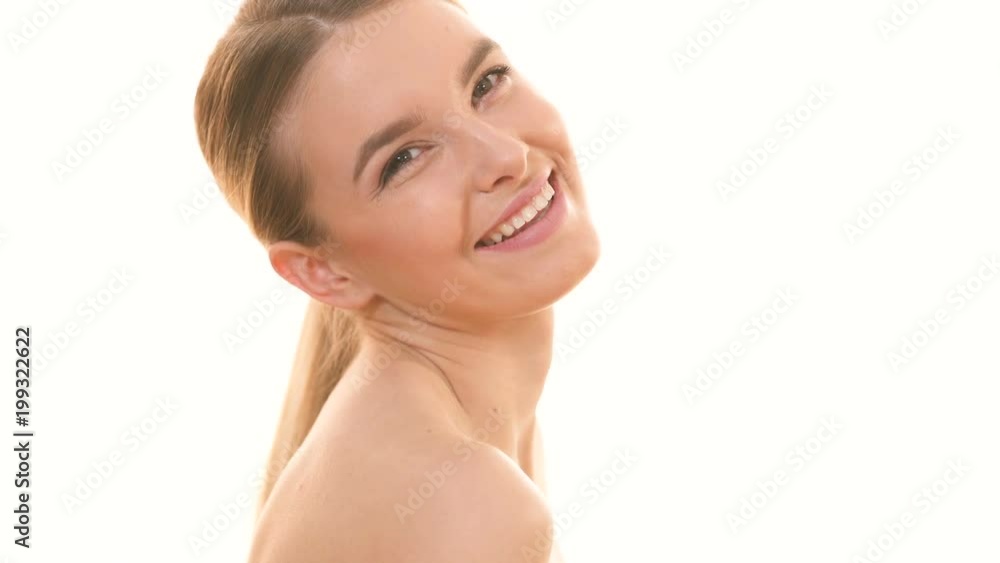 The beauty woman flirting on the white background. slow motion The beauty woman flirting on the white background. slow motion