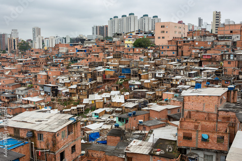 "Paraisopolis" shanty town with high standard buildings in the background.