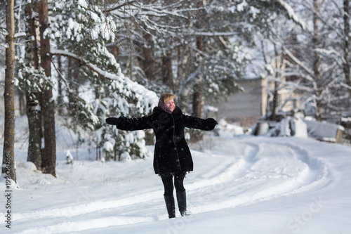 Young woman at winter in the snowy russian village. © De Visu