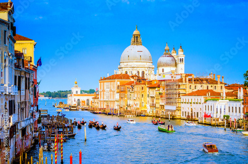 Gorgeous view of the Grand Canal and Basilica Santa Maria della Salute during sunset with interesting clouds  Venice  Italy