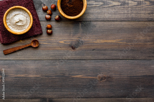 Beauty set with natural hazelnut scrub for spa on wooden background top view mockup