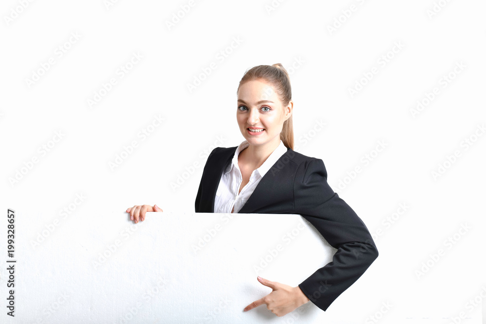 Business Concept. Beautiful businesswoman poses confidently. Young businesswoman pointing on copy space. Beautiful young businesswoman is presenting a job. Business Concept. Beautiful businesswoman poses confidently. Young businesswoman pointing on copy space. Beautiful young businesswoman is presenting a job.