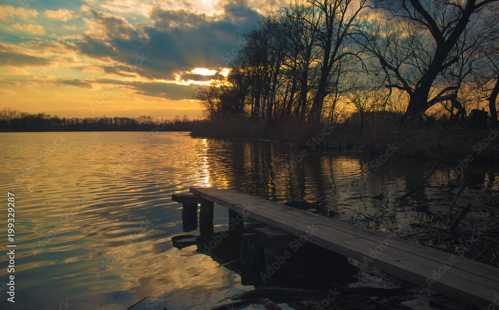 Springboard on shore of lake in the setting sun 7