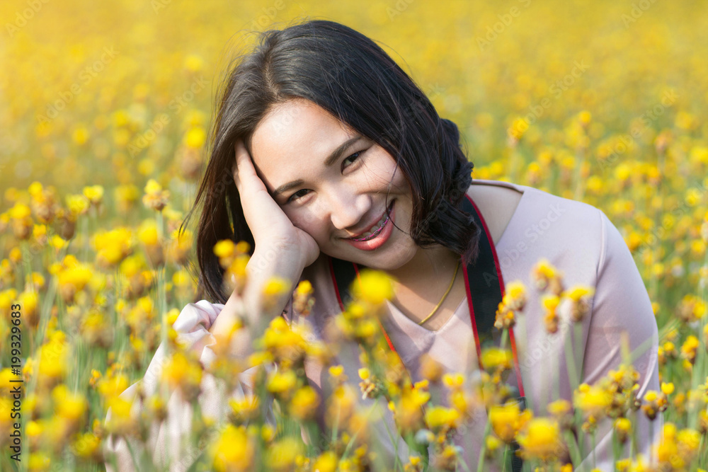 Woman smile in yellow flower field Woman smile in yellow flower field
