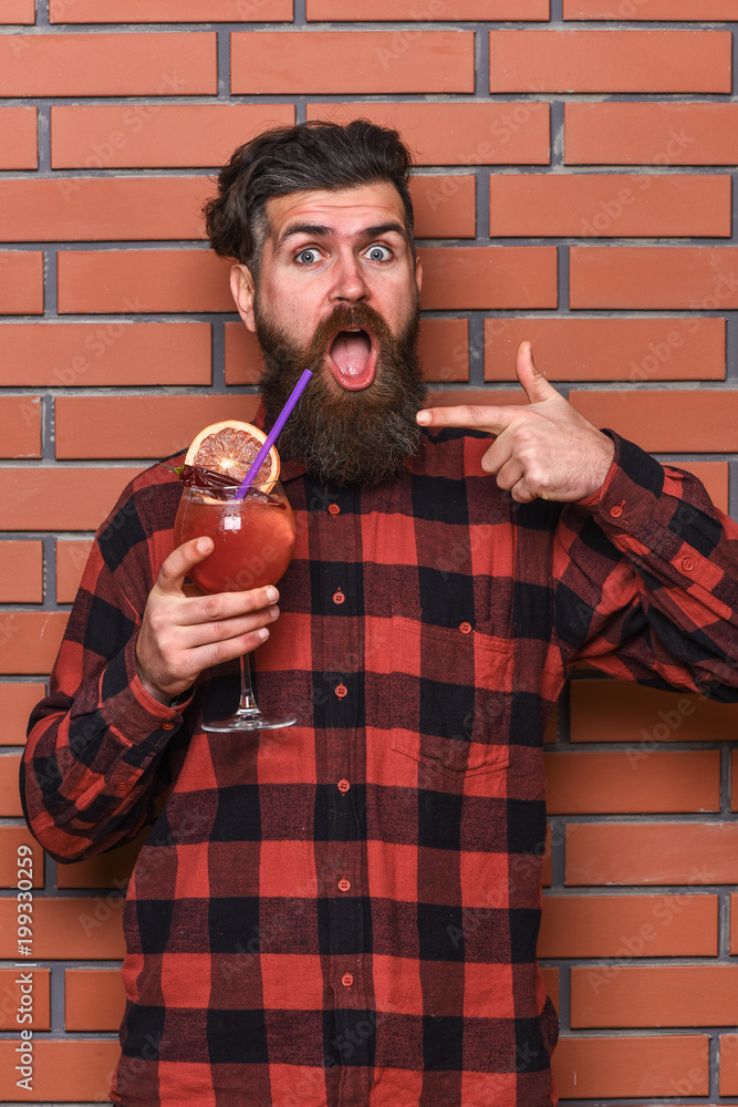Fototapeta premium Bartender recommends to try beverage. Man in checkered shirt