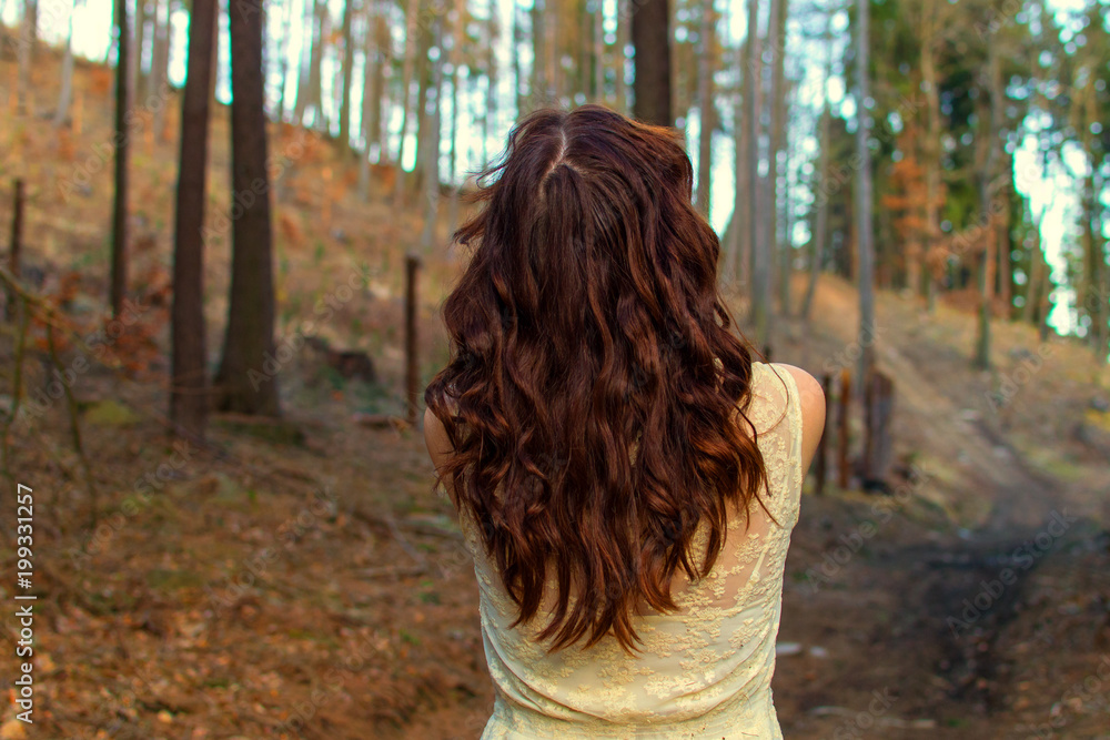 Woman looking into the forest. Woman looking into the forest.
