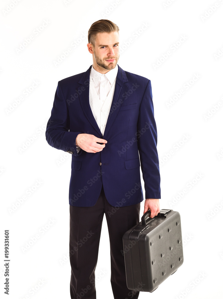 Businessman fastens a button on jacket and holds briefcase. Businessman fastens a button on jacket and holds briefcase.