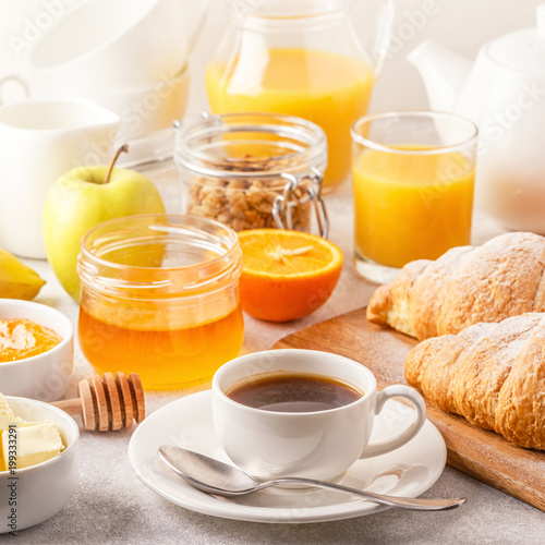 Continental breakfast with fresh croissants, orange juice and coffee