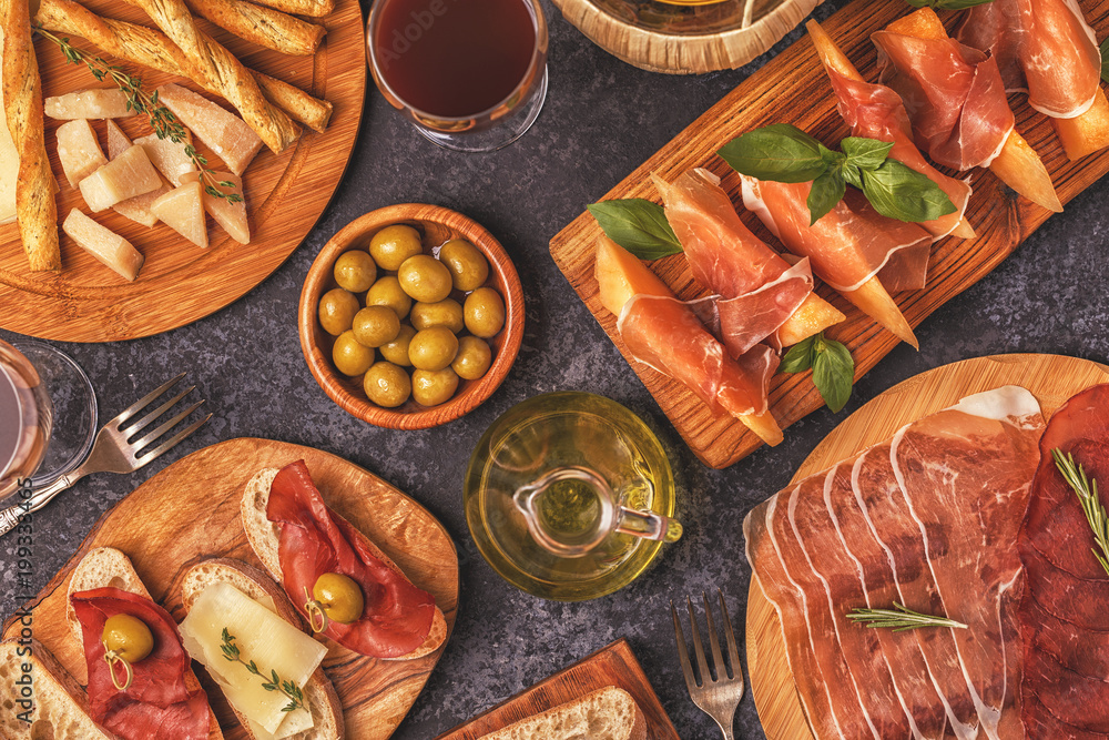 Italian food background with ham, cheese, olives. Italian food background with ham, cheese, olives.