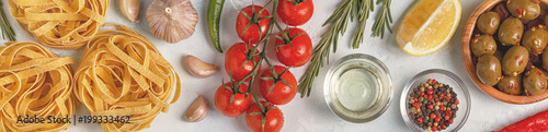 Fotografie Italian food background with pasta, spices and vegetables.