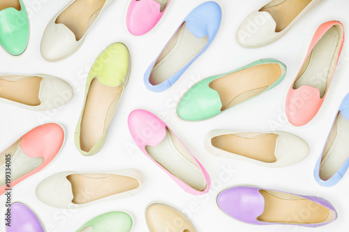 Pattern made of colorful shoes in pastel colors. Beauty and fashion concept. Flat lay, top view
