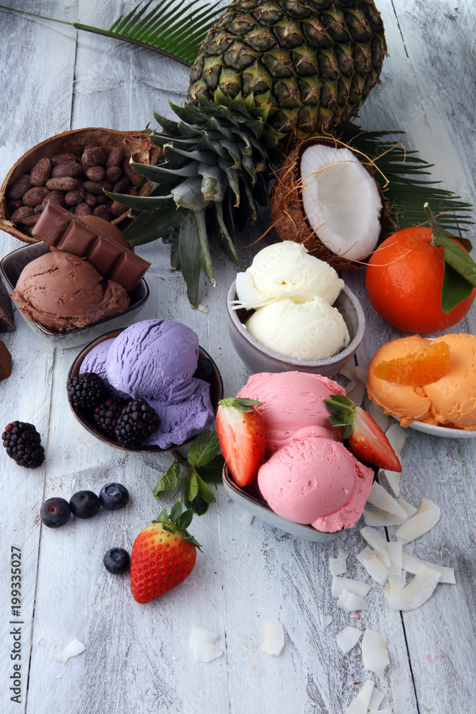 Set of ice cream scoops of different colors and flavours with berries, nuts and fruits Set of ice cream scoops of different colors and flavours with berries, nuts and fruits