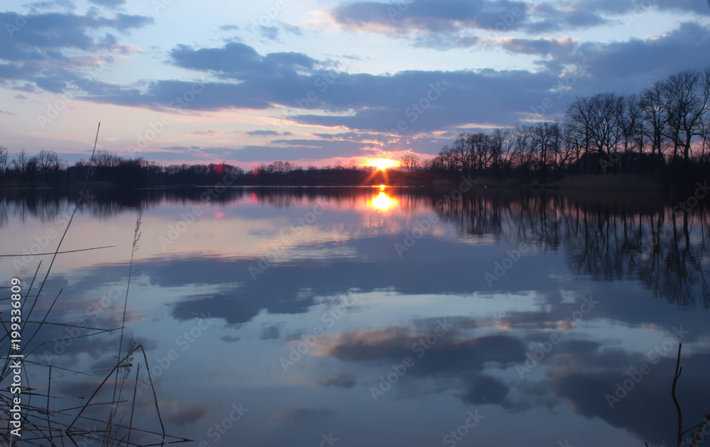 Beautiful idylic scene - sunset over the lake