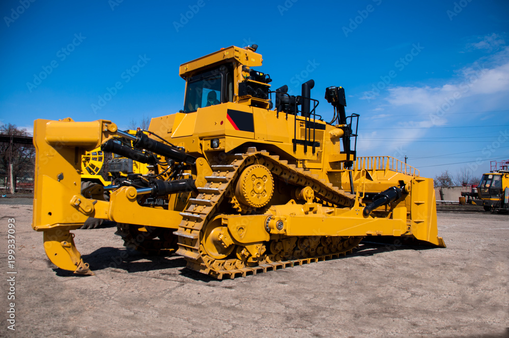 New heavy bulldozer at the industrial site
