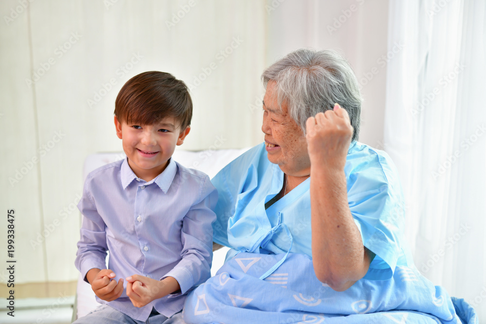 Patient Concept. Grandma's in the hospital. Waiting for someone to visit. Grandchildren visit grandma at the hospital. Grandma is happy to meet grandchildren. Patient Concept. Grandma's in the hospital. Waiting for someone to visit. Grandchildren visit grandma at the hospital. Grandma is happy to meet grandchildren.