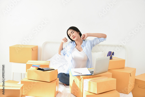 Sme business concept. Young woman is working in the house.Young Owner Start up for Business Online. Young business people are lazy and tired.