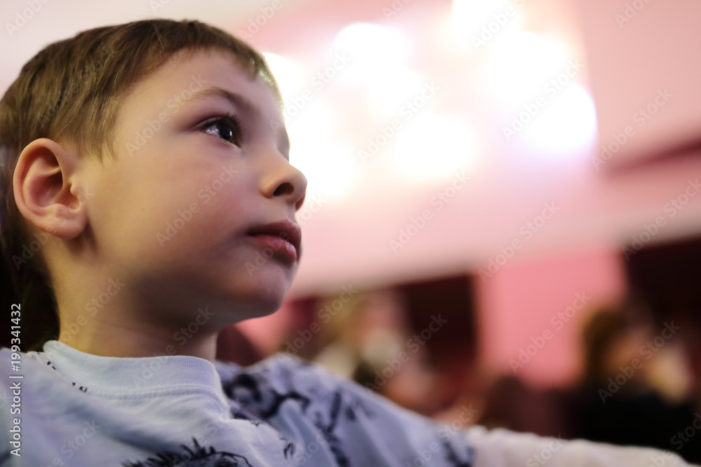 Boy watching theatrical performance Boy watching theatrical performance
