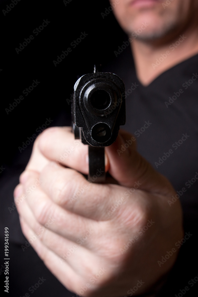 A firearm in the hands of a man defending or attacking A firearm in the hands of a man defending or attacking