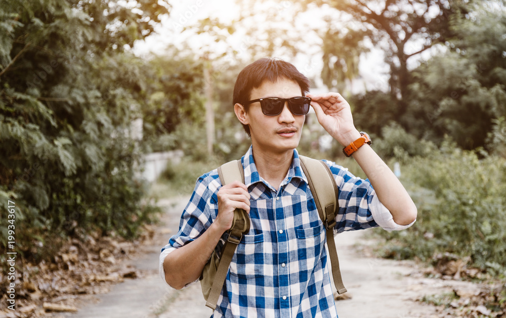 Fototapeta premium Young man traveler travel at countryside nature.