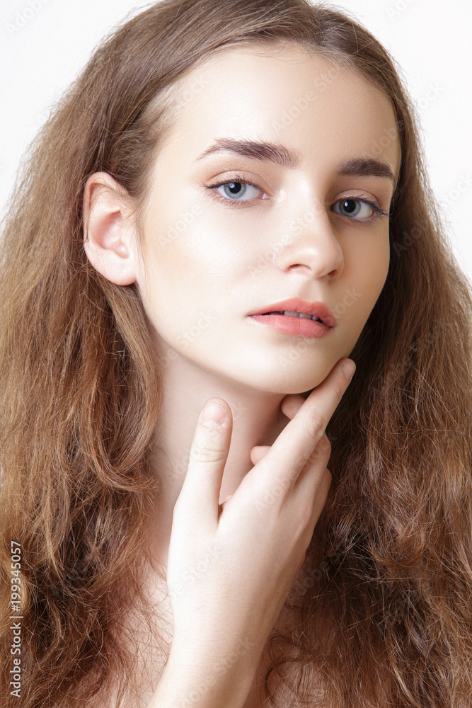 Portrait of a young girl in the studio on a white background Portrait of a young girl in the studio on a white background