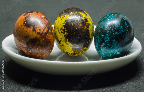 Theme Easter. A small galaxy on a quail egg in a red range.