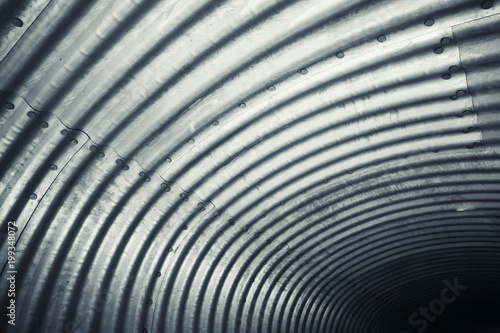 Shiny corrugated steel wall  tunnel pattern