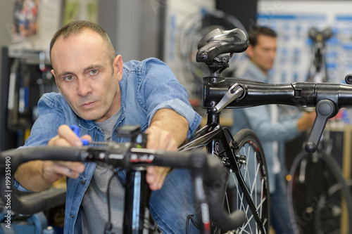 man testing the bike in the store