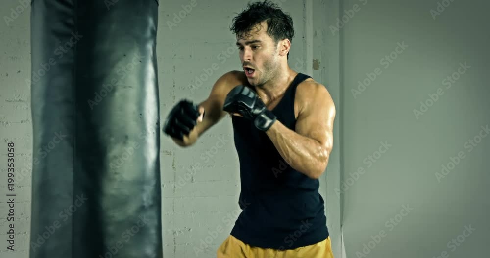 Athletic Male Working Out. Boxing. Slow Motion. Athletic Male Working Out. Boxing. Slow Motion.