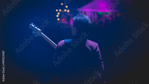 Bass player in concert