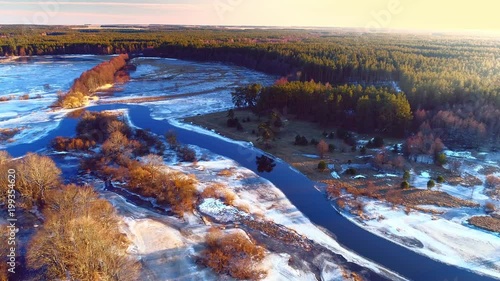Floodplain with ice in spring beginning. Aerial view.