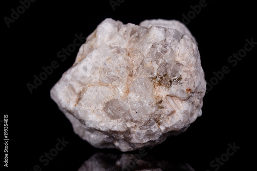 Macro mineral stone Albit on black background photo