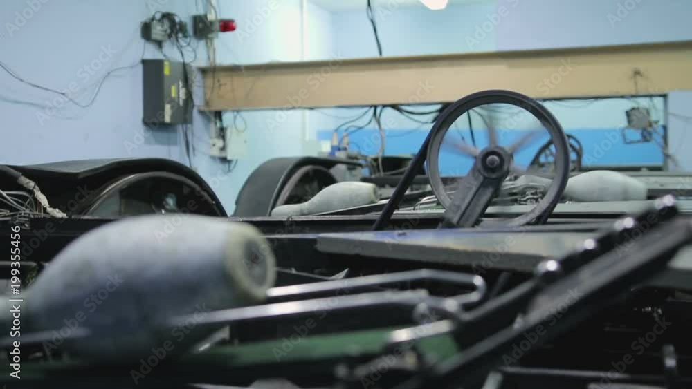 Pinsetter's job at the bowling alley. Spinning pulley, moving on the conveyor pins and bowling balls. Pinsetter's job at the bowling alley. Spinning pulley, moving on the conveyor pins and bowling balls.