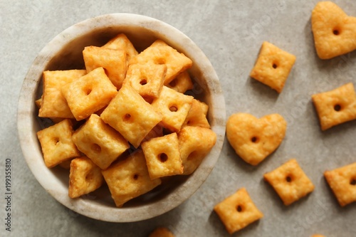 Homemade square Cheese Crackers in a bowl photo