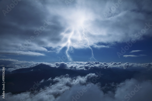 Photography Dramatic scene of thunderstorm with lightning in dark stormy sky in mountains Carpathian, Ukraine