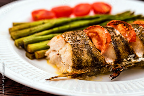 Photography Roasted zander fillet with asparagus and lemon