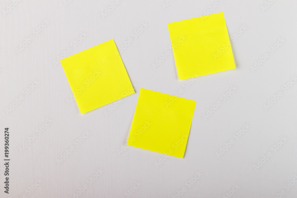 Mock-up lot of yellow empty office stickers on white background Mock-up lot of yellow empty office stickers on white background