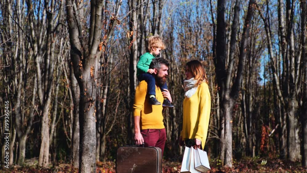 sale, consumerism and people concept - happy family with little child and shopping bags. Family shopping. sale, consumerism and people concept - happy family with little child and shopping bags. Family shopping.